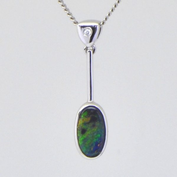 Natural solid black opal pendant set in 18ct white gold